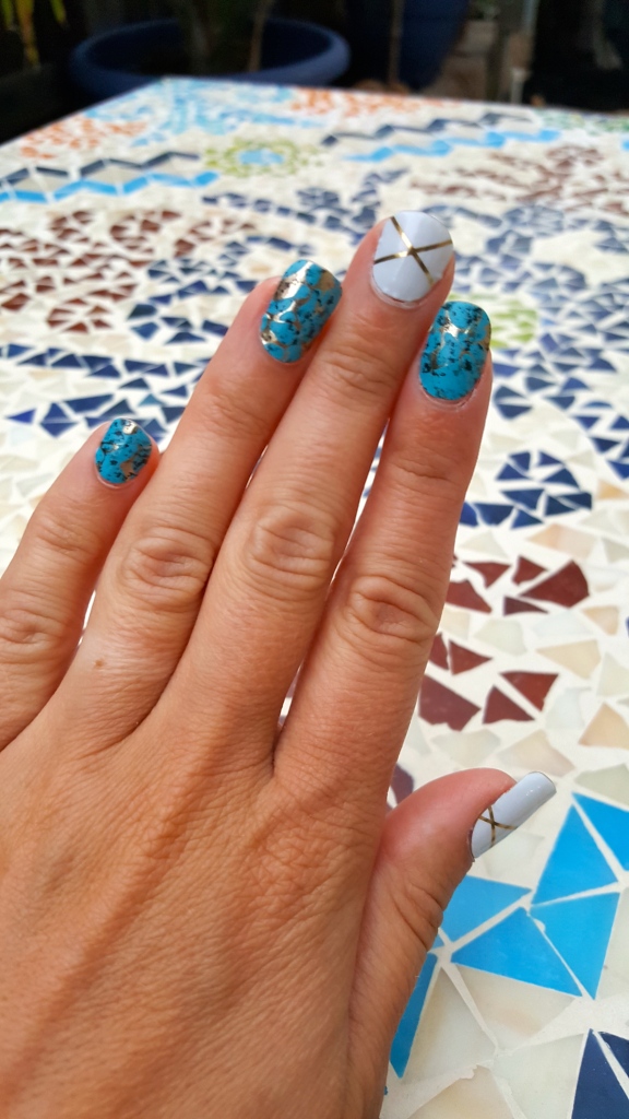 Jamberry Turquoise with Gatsby on middle and thumb